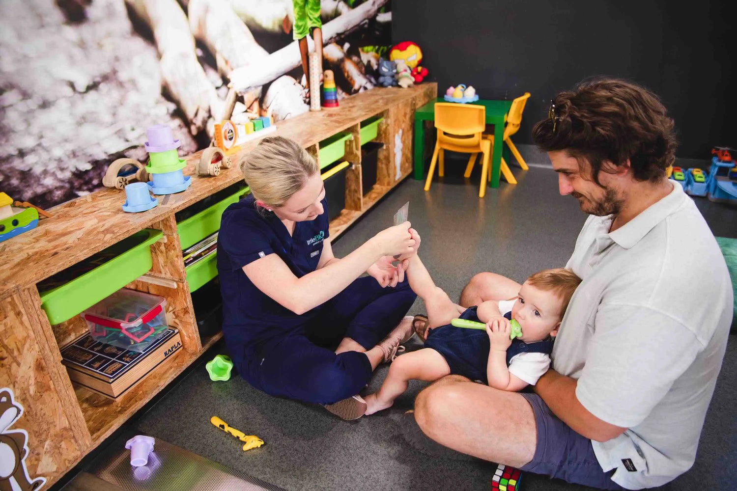 Lady measuring baby's feet